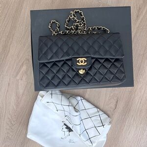 CHANEL Black Quilted Shoulder Bag with Gold Accents